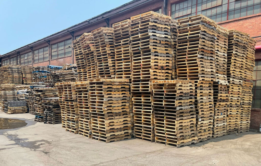 stacks of wooden pallets outside of our Buffalo NY warehouse
